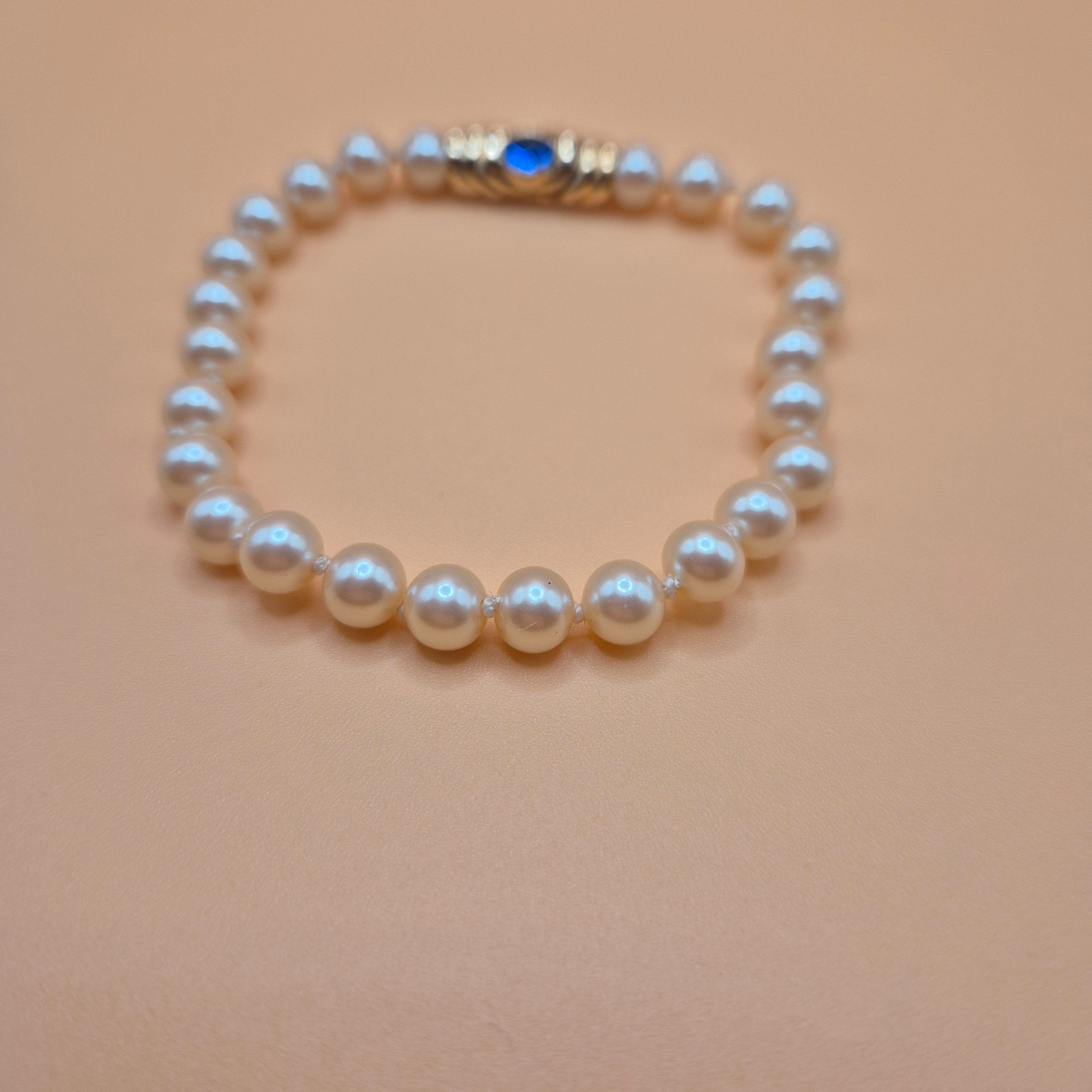 Vintage unechtes Perlenarmband mit blauem Stein 80er Jahre