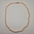 Elegante Modeschmuck-Perlenkette mit Saphir-Blauem Akzent