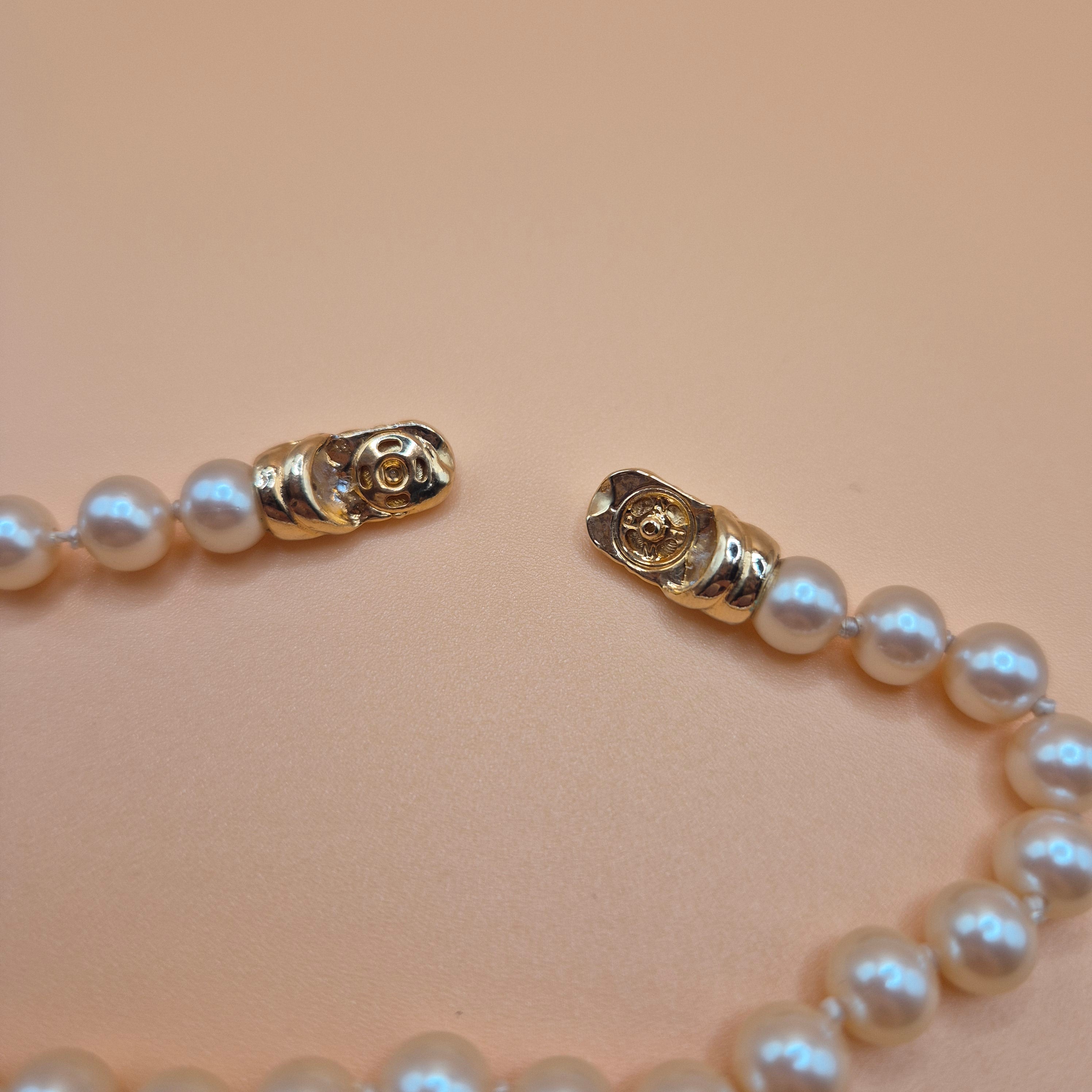 Vintage unechtes Perlenarmband mit blauem Stein 80er Jahre